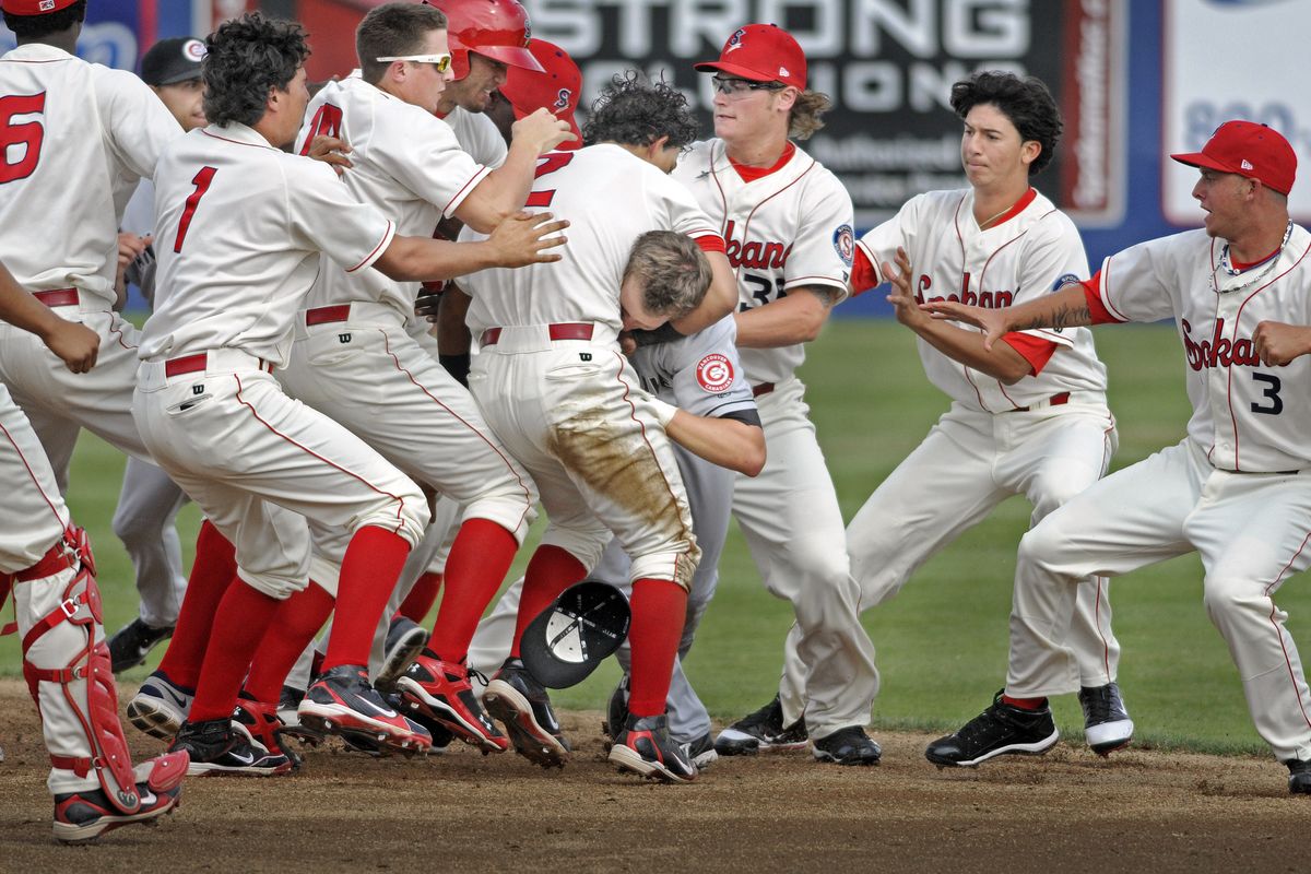 Spokane Indians shortstop Rougned Odor clamps a headlock on Shane Opitz of Vancouver during a bench-clearing brawl July 11 at Avista Stadium, helping the team earn a 2011 Budnick Award. (File)