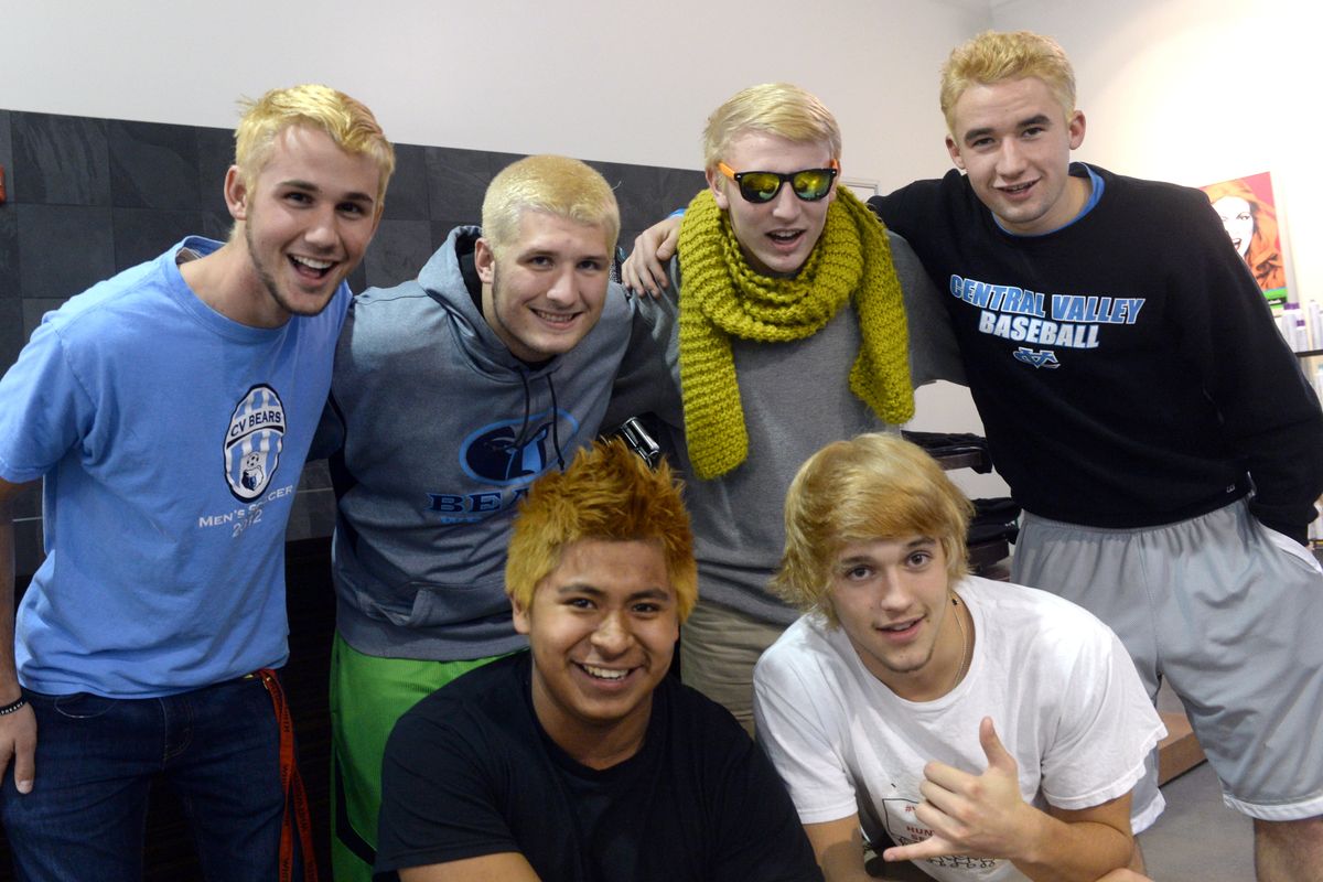 Clockwise from top left: Braden Corigliano, Lowell Kovacich, Hayden Wolrehammer, Daisy Daines, Gerardo Ramirez and Tucker Stout bleached their hair blond at Paul Mitchell the School in Spokane Valley on Wednesday. The Central Valley High School boys challenged classmates to donate to the Spokane Valley Partners Food Bank and the donations exceeded expectations, raising $12,600. (Jesse Tinsley)