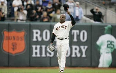 
Associated Press Few local readers are prepared to tip their cap to Barry Bonds for passing Hank Aaron's all-time home run record.
 (Associated Press / The Spokesman-Review)