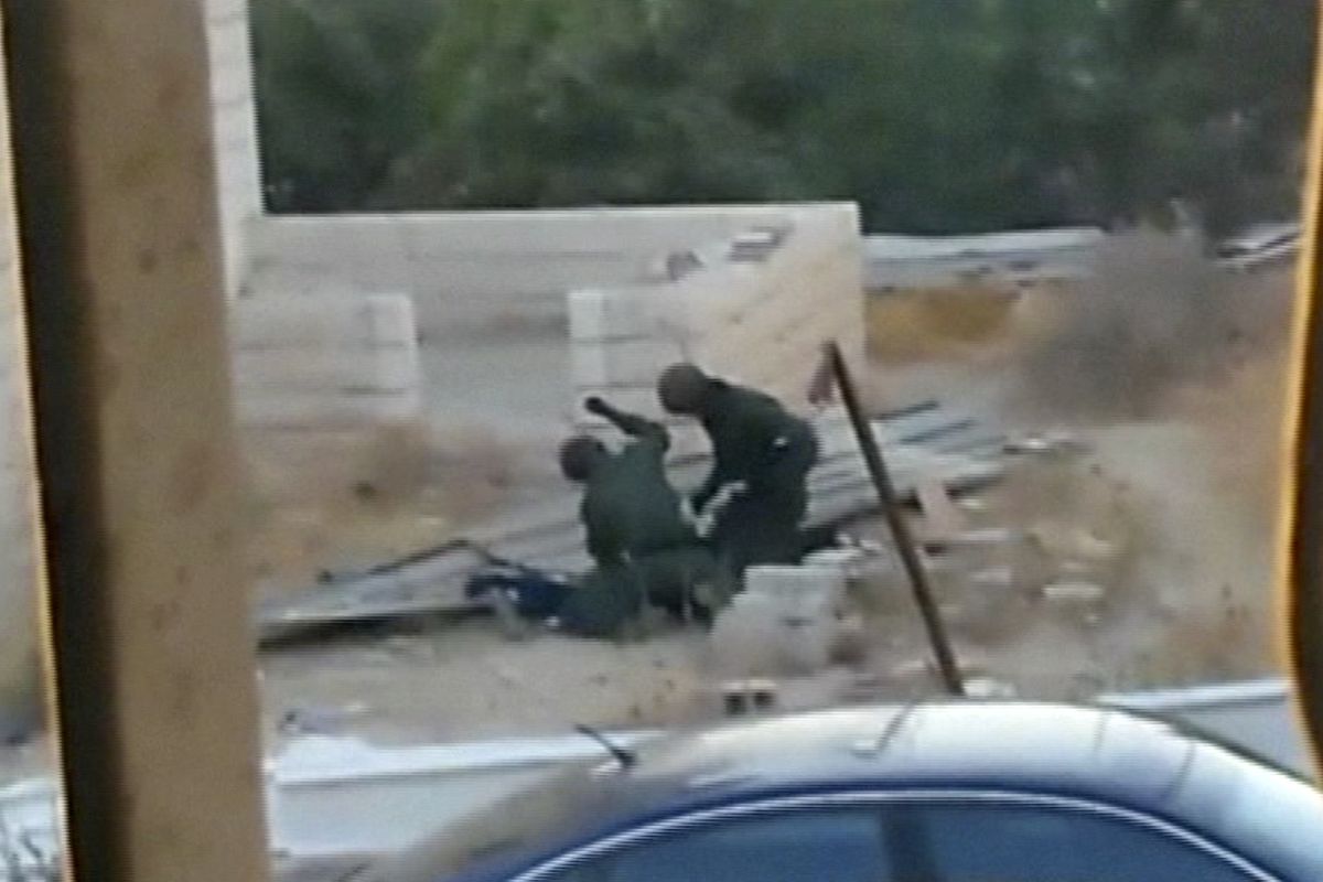 Israeli soldiers beat Tariq Abu Khdeir, 15, a U.S. citizen and Florida resident, prior to his arrest in Jerusalem, in this image taken Friday from an amateur video. Tariq is a cousin of Mohammed Abu Khdeir, who Palestinians say was killed by Israeli extremists as revenge for three Israeli teens’ deaths. (Associated Press)
