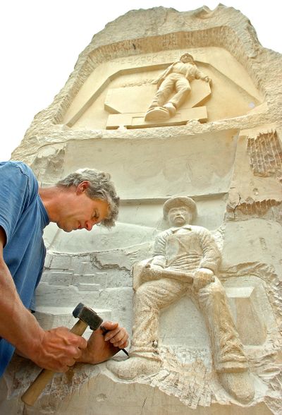 Sculptor Paul Keeslar of Yelm, Wash., works on a piece of  sandstone for the Wilkeson, Wash., Centennial Celebration in July.  (Associated Press / The Spokesman-Review)