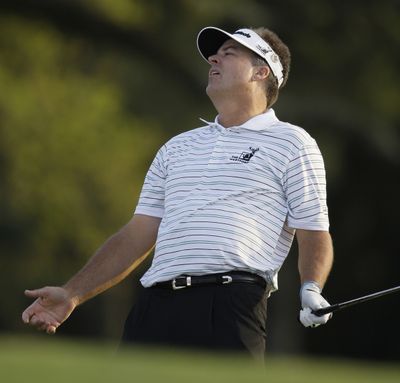 Kenny Perry reacts after his chip shot missed the cup on the first hole of the playoff. (Associated Press / The Spokesman-Review)