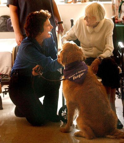 
Hospice volunteer Suzie Michalek, left, and Ranger visit with Dorothy Fredericks at Royal Park Care Center in Spokane. 
 (The Spokesman-Review)