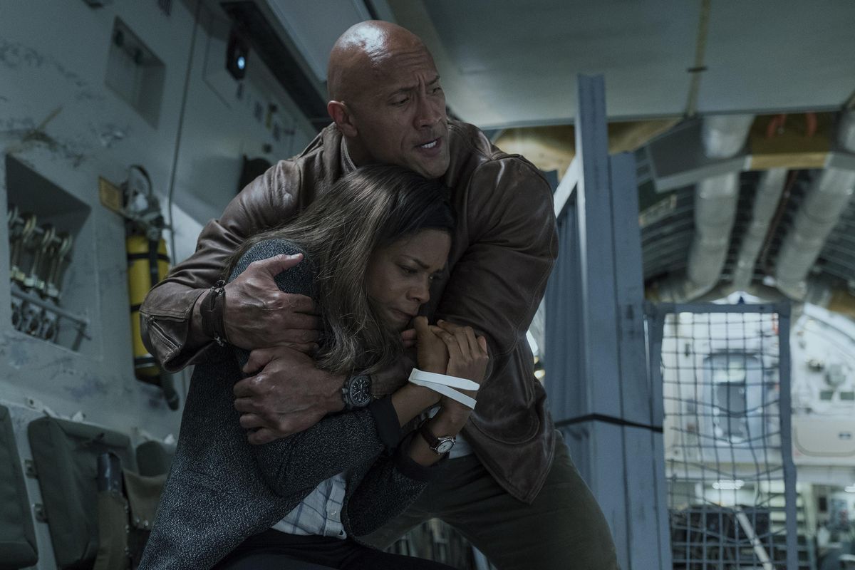 From left, Naomie Harris as Dr. Kate Caldwell and Dwayne Johnson as Davis Okoye in the film “Rampage.” (Frank Masi / Warner Bros.)