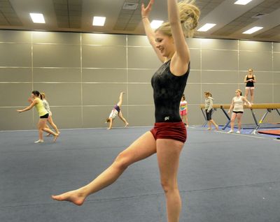 Junior Stacie Davis works out with her U-Hi gymnastic teammates Tuesday. She won the first all-around competition of the young gymnastic season and is also an honor roll student. (J. Bart Rayniak)