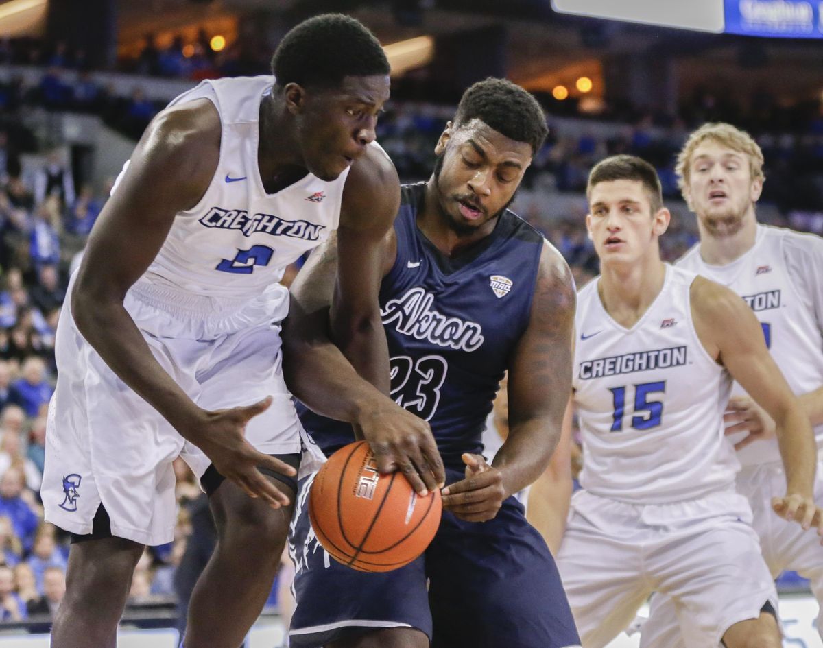 Creighton’s Khyri Thomas (2) steals the ball from Akron’s Isaiah Johnson (23) with forward Martin Krampelj (15) watching, during the first half of an NCAA college basketball game in Omaha, Neb., Saturday, Dec. 3, 2016. (Nati Harnik / Associated Press)