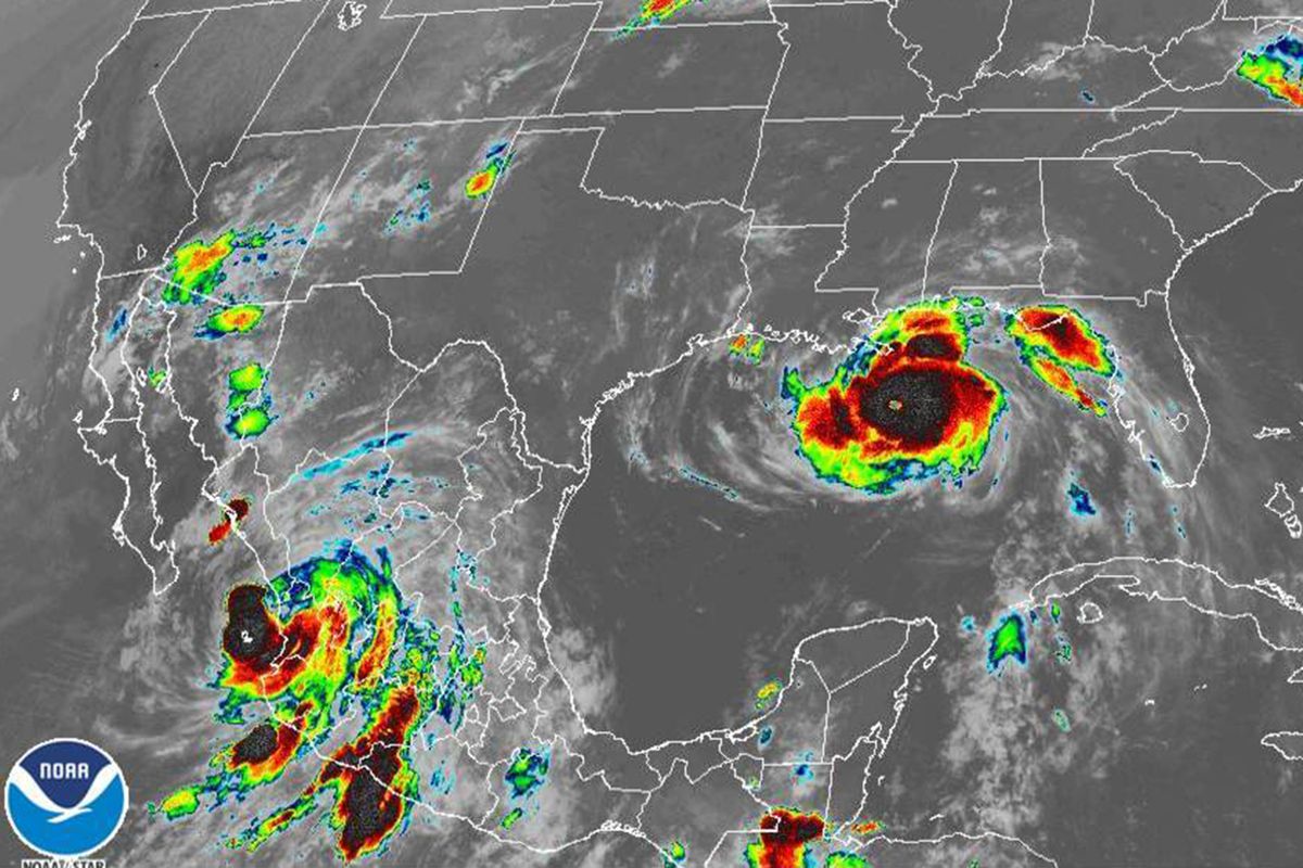 This image provided by the National Oceanic and Atmospheric Administration (NOAA) shows severe weather systems, Hurricane Nora, lower left, and Hurricane Ida, right, over the North American continent on Sunday, Aug. 29, 2021. Hurricane Nora is churning northward up Mexico