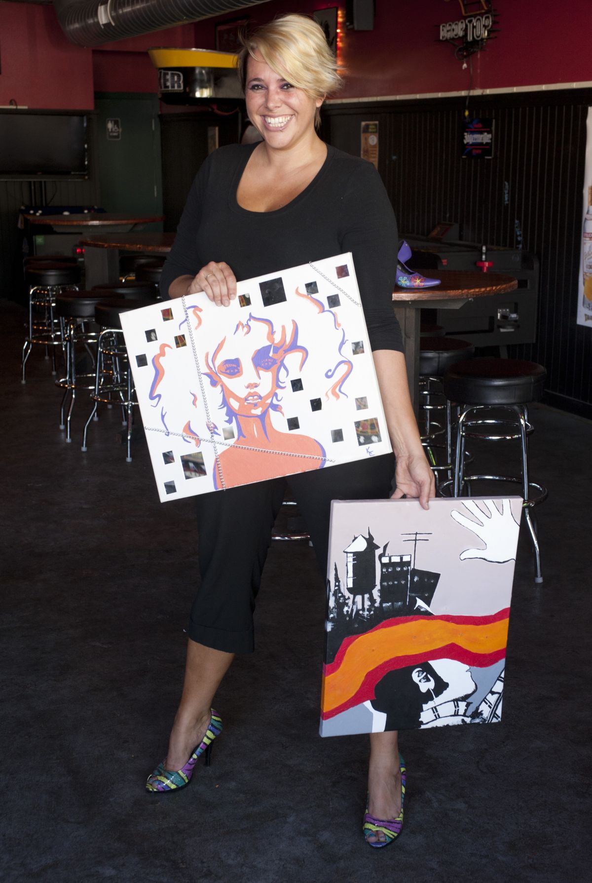 In addition to painting on dresses, Kadra Evans paints on canvas and shoes.