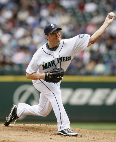Mariners starter Erik Bedard has been healthy and stingy recently. (Associated Press / The Spokesman-Review)