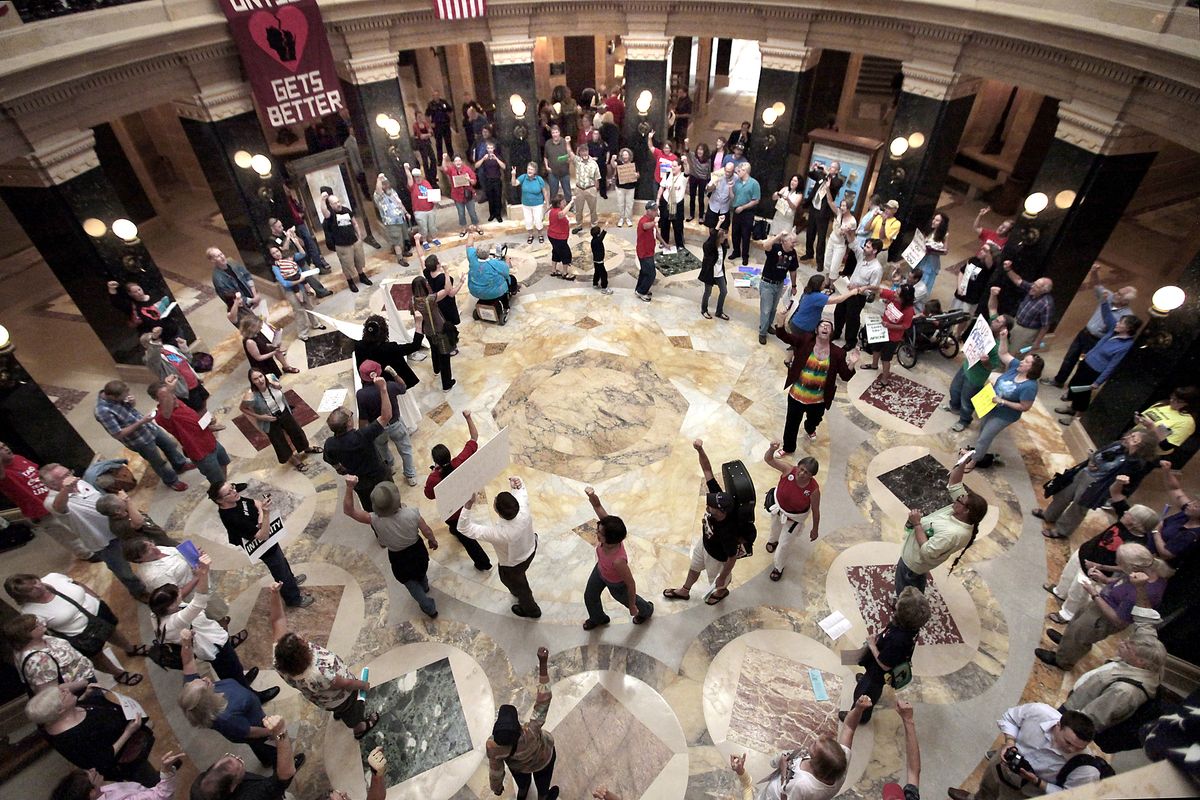 In this Sept. 7, 2012 photo, dozens of singers gather in the state Capitol rotunda for the 455th consecutive Solidarity sing along in the wake of a crackdown on protests without a permit by new Capitol Police Chief David Erwin. Most of the demonstrations against Wisconsin Gov. Scott Walker ended a long time ago. But every weekday at noon, a few dozen people still gather inside the state Capitol and sing protest songs for an hour. (John Hart / Wisconsin State Journal)
