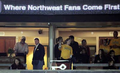 
Clay Bennett, second left, visits Bill Russell at Thursday's game. Associated Press
 (Associated Press / The Spokesman-Review)