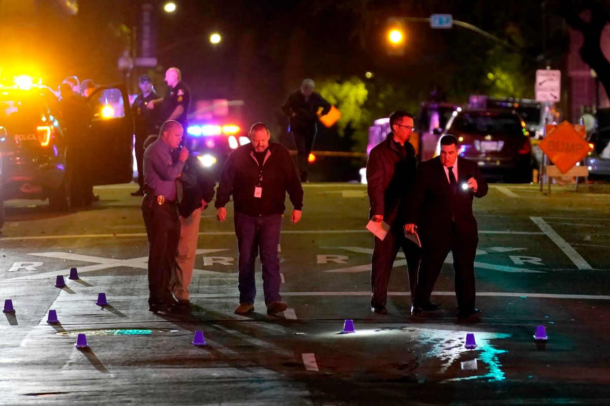 FILE — Authorities search the scene of a mass shooting in Sacramento, Calif. on April 3, 2022. The shooting, which left six dead and 12 wounded, occurred near the state Capitol, an area that in recent years has been rattled by rising crime, protests and the economic drubbing of the pandemic.  (Rich Pedroncelli)