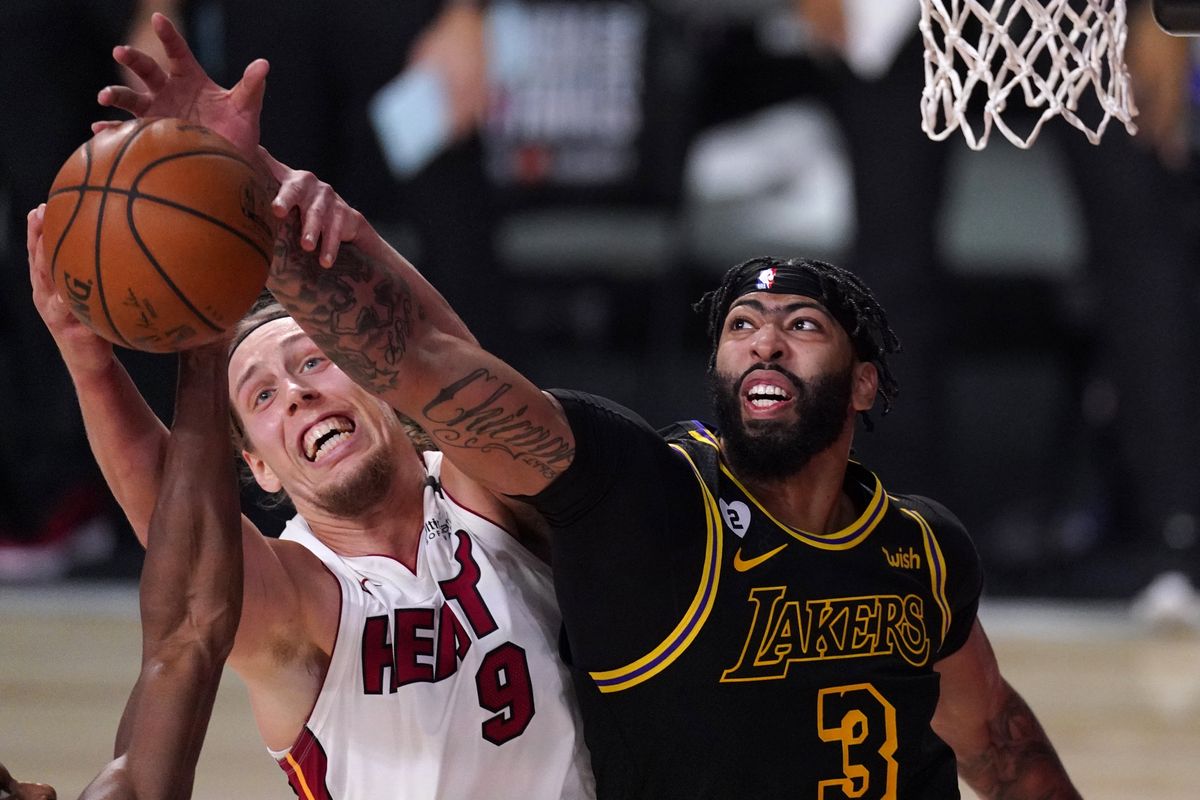 Miami’s Kelly Olynyk and the Los Angeles Lakers’ Anthony Davis battle for a rebound during the second half of Game 2 of the NBA Finals on Friday night.  (Mark J. Terrill)