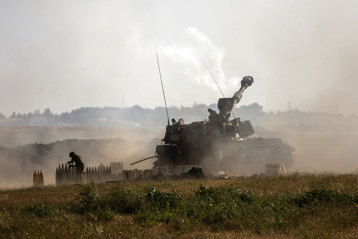 An Israeli artillery unit fires toward targets in the Gaza Strip, at the Israeli-Gaza border, Sunday, May 16, 2021.  (Heidi Levine)