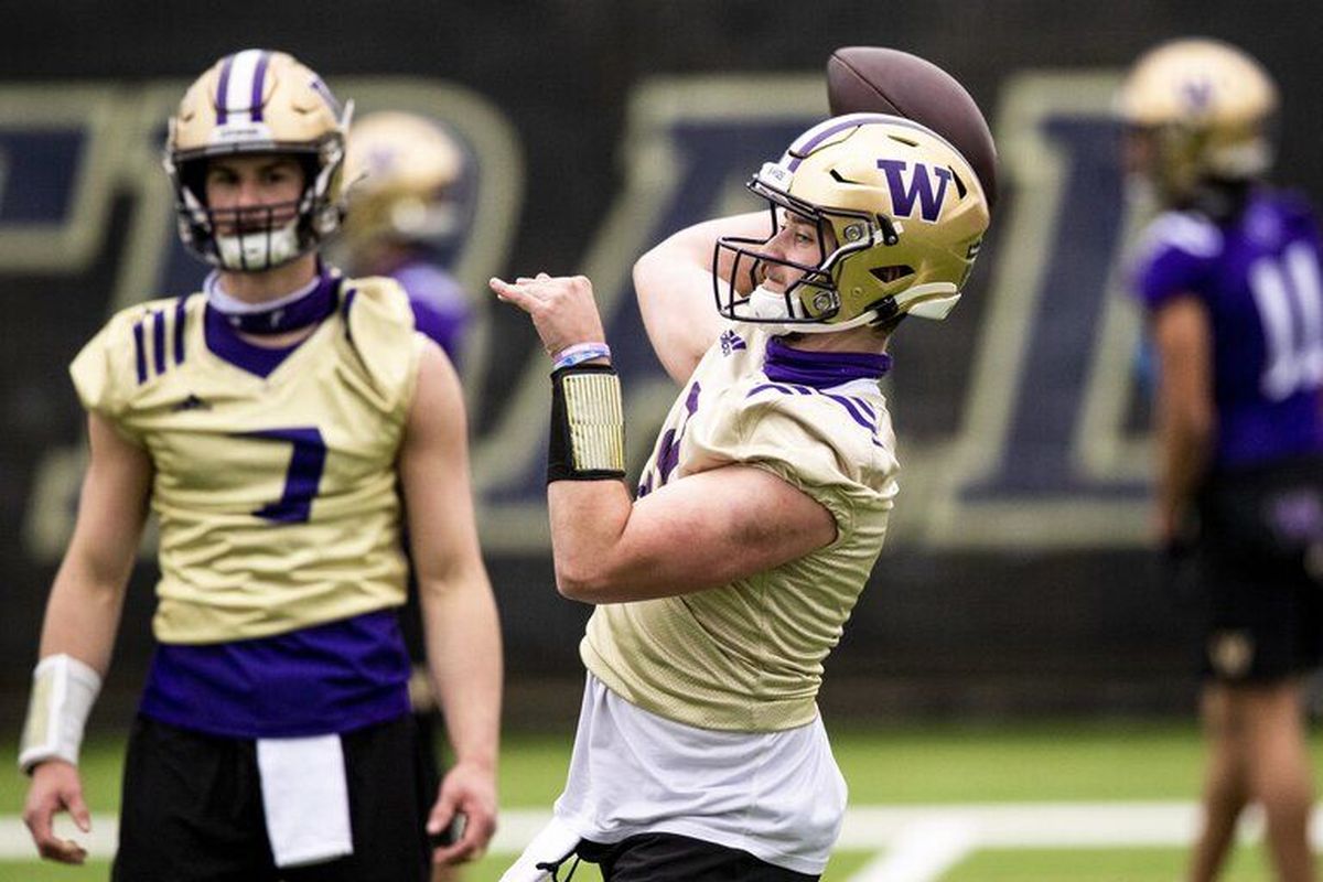 {span}Quarterback Dylan Morris (9) throws the ball to a receiver during spring practice at the east practice field on Wednesday, April 7, 2021. Behind is Sam Huard (7). {/span}  (Amanda Snyder / The Seattle Times)