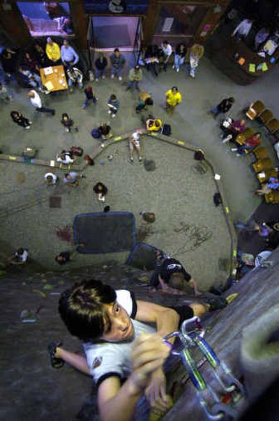 
Evan Ingelson, 14, climbs during the competition Saturday at Wild Walls. 
 (Jed Conklin / The Spokesman-Review)