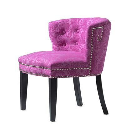 An accent chair in a vibrant pink damask pattern adds a touch of traditional style in a contemporary hue. (Associated Press)