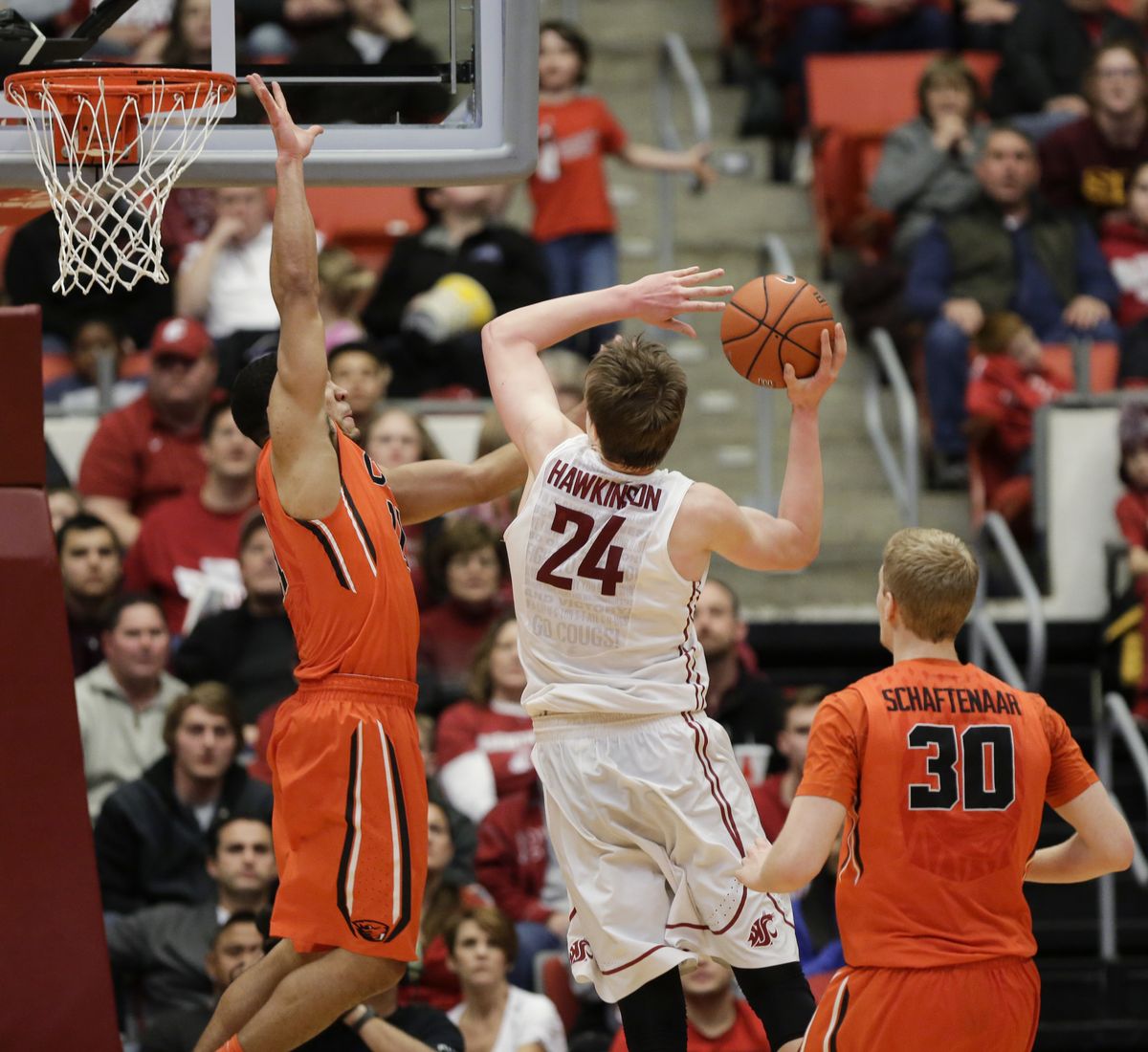 Washington State’s Josh Hawkinson draws foul on OSU’s Malcolm Duvivier, left. (Associated Press)