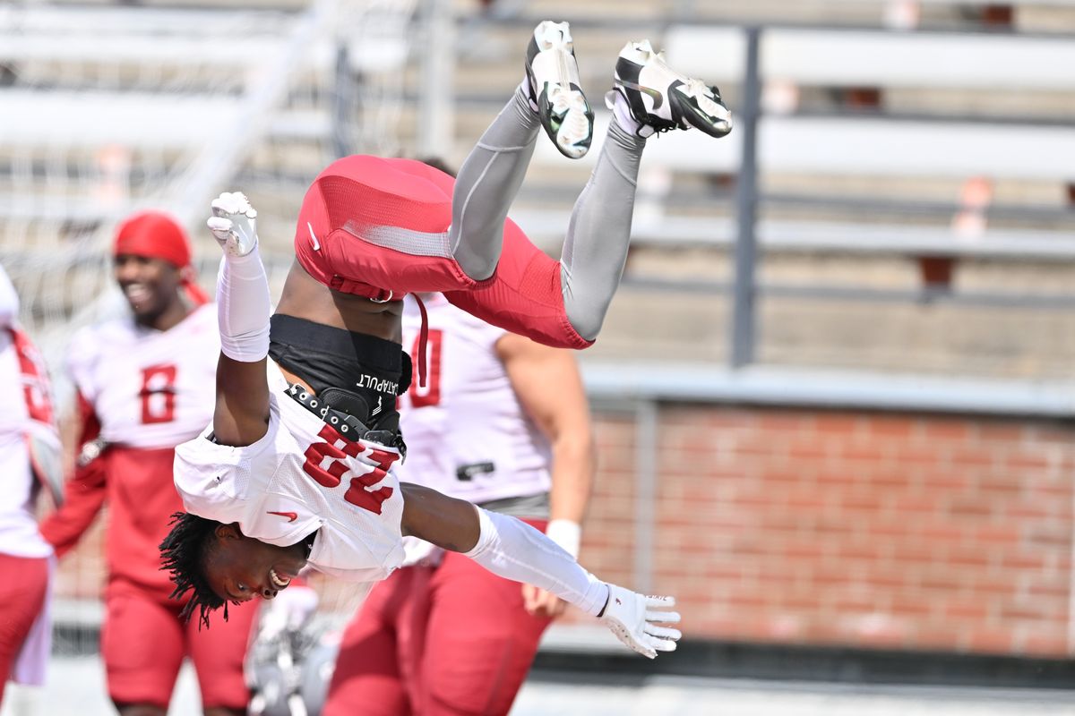 Washington State Cougars defensive back Javan Robinson (23) does a backflip in celebration during a spring scrimmage on Saturday, April 15, 2023, at Martin Stadium in Pullman, Wash.  (Tyler Tjomsland/The Spokesman-Review)