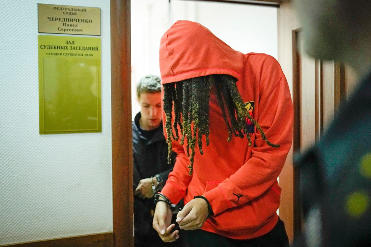 WNBA star and two-time Olympic gold medalist Brittney Griner leaves a courtroom after a hearing in Khimki, just outside Moscow, on Friday.  (Alexander Zemlianichenko)