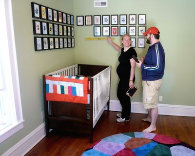 Christina and Stephen McHenry arrange kid-friendly art in their nursery. King Features (King Features)