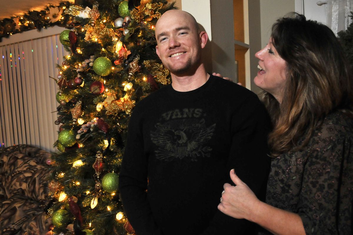 Ty Carter, pictured with his mother Paula Carter, was home in Spokane over Christmas 2011 after a tour in Afghanistan, where he sustained multiple concussions, earned a Purple Heart and survived many skirmishes with Taliban fighters. (Jesse Tinsley)