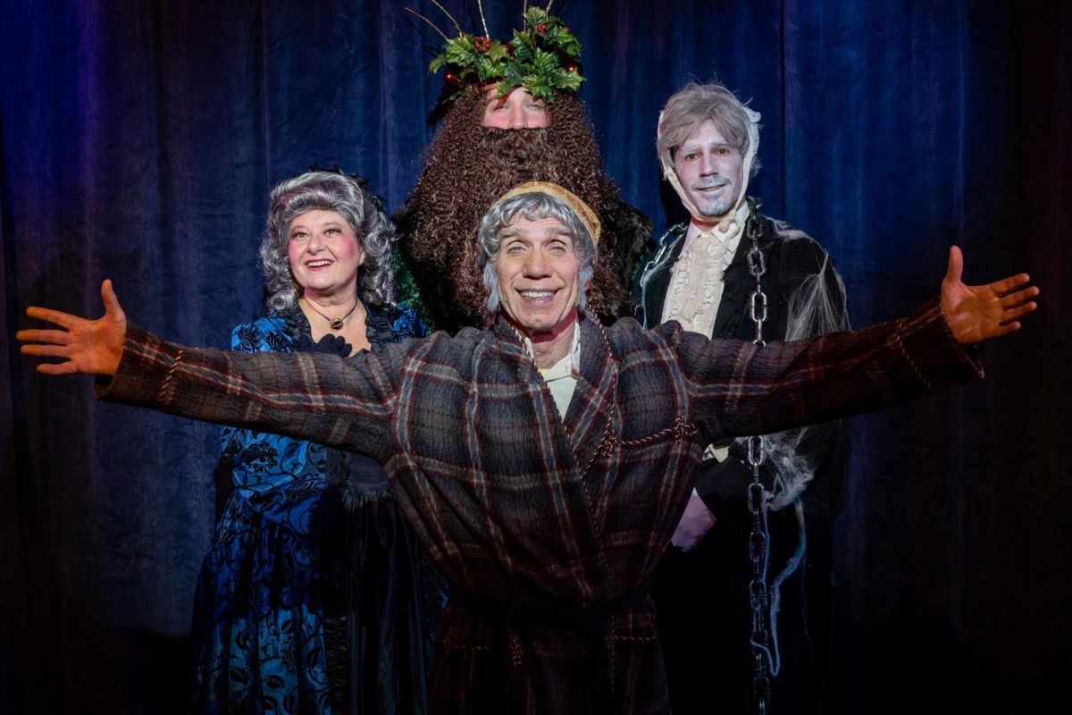 Jonathan Fluck as Scrooge, center, in the Regional Theater of the Palouse’s production of “Scrooge: The Musical.” In back, from left, are Tina McClure as Ghost of Christmas Past, Gavin Hamilton as Ghost of Christmas Present and Cody Wednt as Jacob Marley.  (Courtesy of Eric Lozaga)