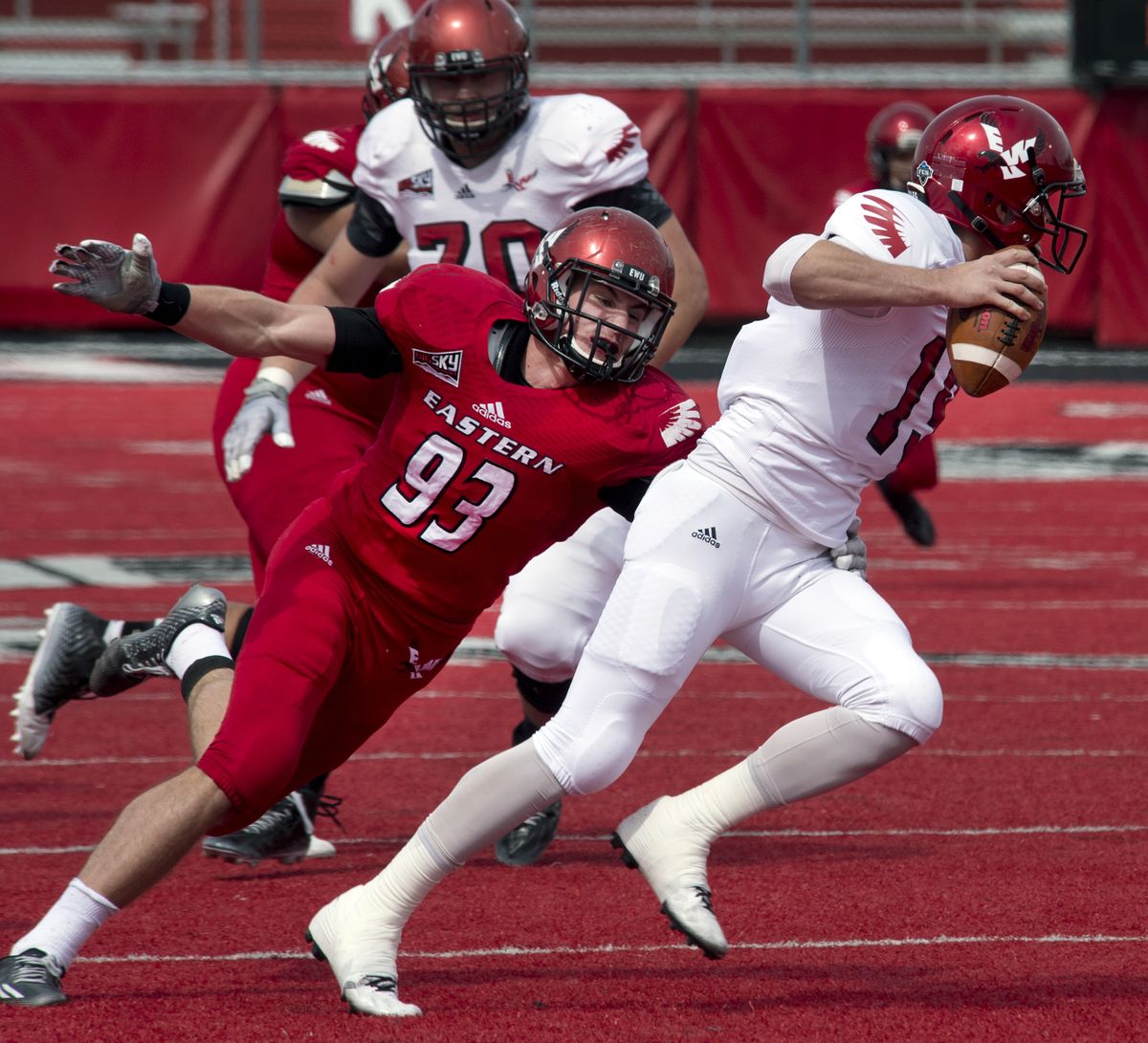 Eagles DL Marcus Saugen gets a hand on QB Gage Gubrud during the Red-White Game on Saturday. (Dan Pelle)