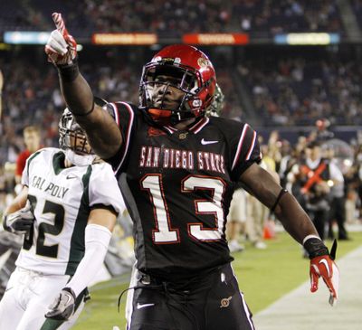San Diego State running back Ronnie Hillman celebrates his 27-yard touchdown run in the fourth quarter of the Aztecs' season opener against Cal Poly on  Sept. 3. San Diego State won 49-21.  (Associated Press)