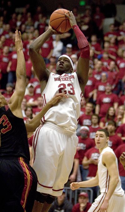 Washington State forward DeAngelo Casto (23) shoots over Southern California forward Garrett Jackson, left, and draws a foul as Washington State's Klay Thompson, right, watches during the first half of an NCAA college basketball game Thursday, March 3, 2011, in Pullman, Wash. (Dean Hare / Fr158448 Ap)