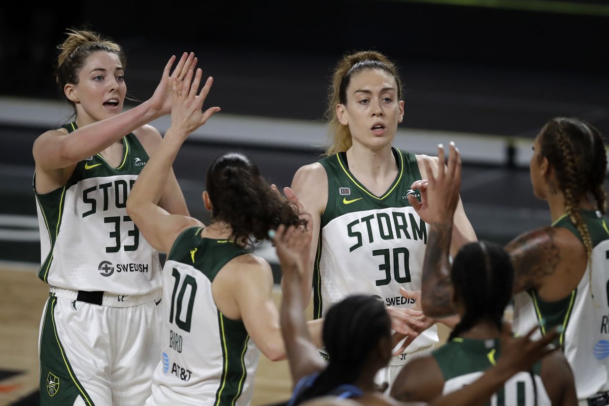 Seattle Storm players, including Katie Lou Samuelson (33) and Breanna Stewart (30), celebrate a score against the Atlanta Dream in the second half of a WNBA basketball game Friday, June 11, 2021, in College Park, Ga. (Associated Press)