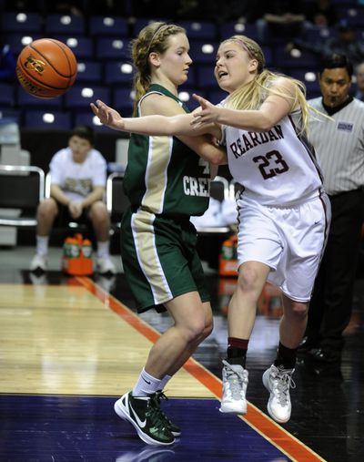 Reardan’s Chantel Heath tries to make a pass before Bear Creek’s Nikki Peterson forces her out of bounds. (Colin Mulvany)