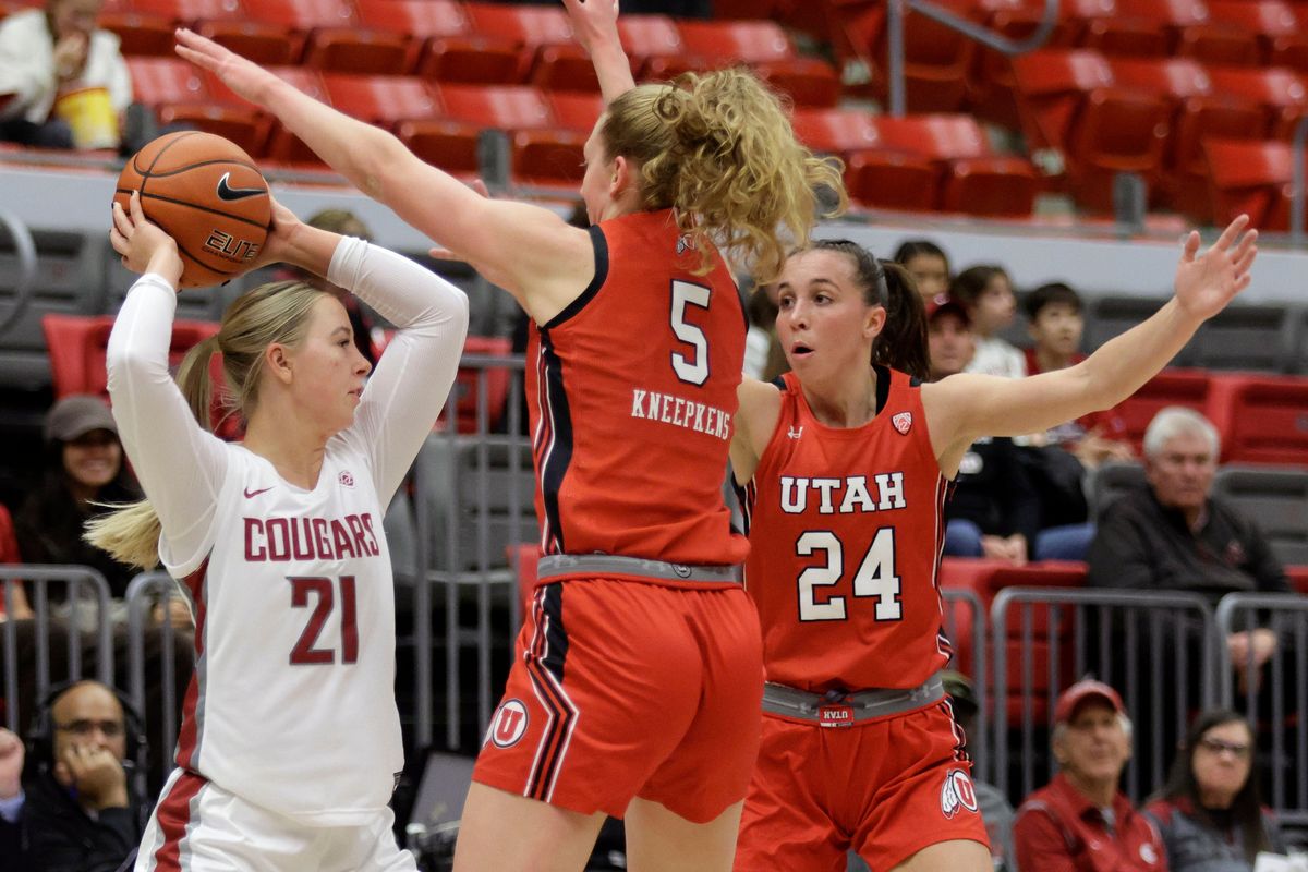Washington State guard Johanna Teder tries to pass under pressure from Utah’s Gianna Kneepkens and Kennady McQueen in the first half Friday at Beasley Coliseum in Pullman.  (Geoff Crimmins/FOR THE SPOKESMAN-REVIEW)