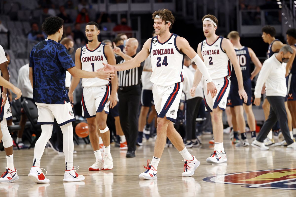 Teammates congratulate Gonzaga forward Corey Kispert (24) during a timeout against Virginia at Dickies Arena in Fort Worth, Texas on December 26, 2020.   (Courtesy of Gregg Ellman)