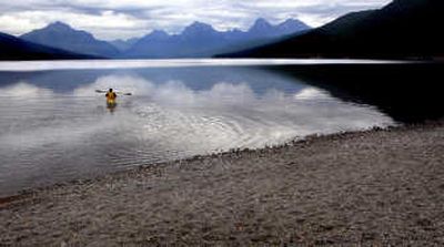 
A kayaker heads out on to Lake McDonald in Glacier National Park on Sept. 7.  Rapidly changing climate is driving record low water levels in the park's streams and lakes as glaciers continue to thaw. Associated Press
 (Associated Press / The Spokesman-Review)