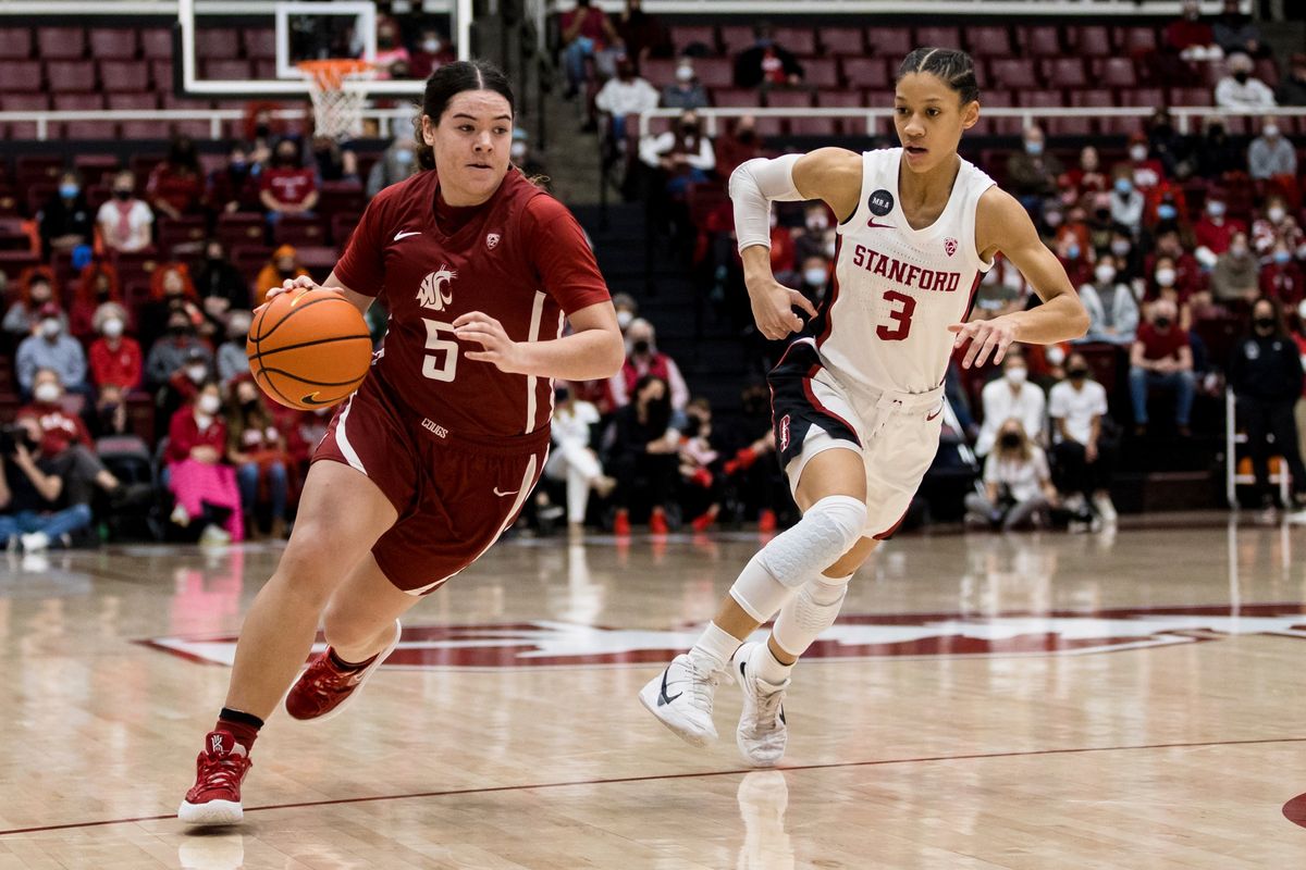 Washington State guard Charlisse Leger-Walker, left, drives past Stanford guard Anna Wilson during the second half of a Pac-12 game Thursday at Maples Pavilion in Stanford, California.  (Associated Press)