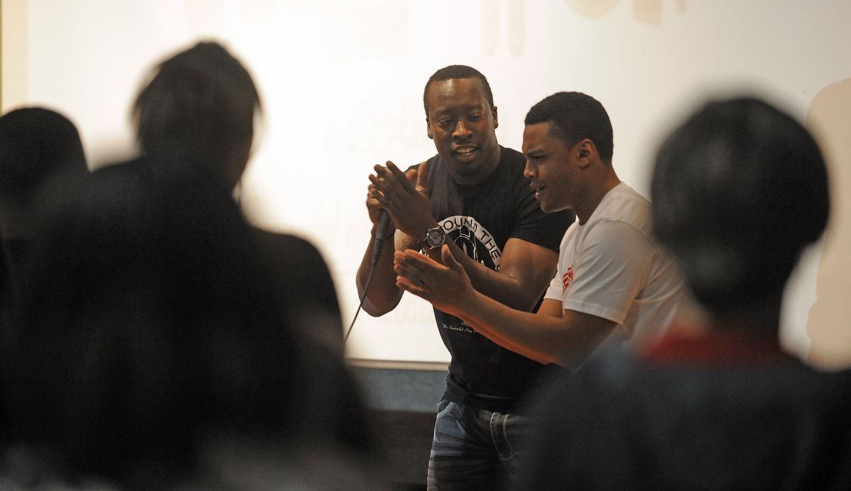 Isaac Butts, left, and Skylar Lamb, members of Wake Up, work a rap during a Sheridan Elementary School sixth-grade assembly on Friday. (PHOTOS BY CHRISTOPHER ANDERSON)