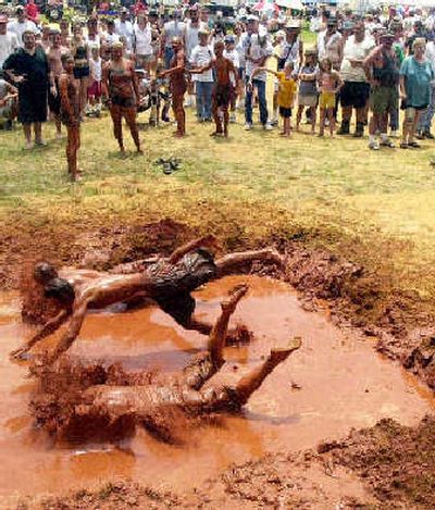 
The mudpit belly-flop is just one of the events to be held at the annual Redneck Games Saturday in Georgia. 
 (Associated Press / The Spokesman-Review)