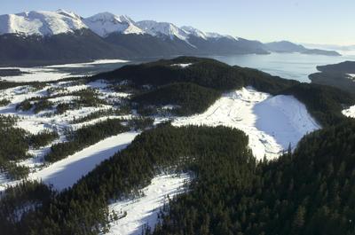 In this Feb. 1, 2007, picture, snow covers Lower Slate Lake, right, in the Tongass National Forest, with Berners Bay in the background. (File Associated Press / The Spokesman-Review)