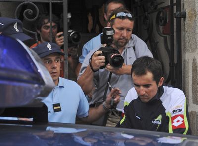 Manuel Beltran, bottom right, is taken into custody on Friday.  (Associated Press / The Spokesman-Review)