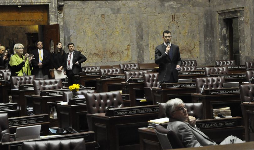 OLYMPIA -- Sen. Joe Fain (standing) moves to adjourn the regular session of the 2016 Legislature to a nearly empty Senate chamber. Less than a half hour later the special session started. (Jim Camden/The Spokesman-Review)