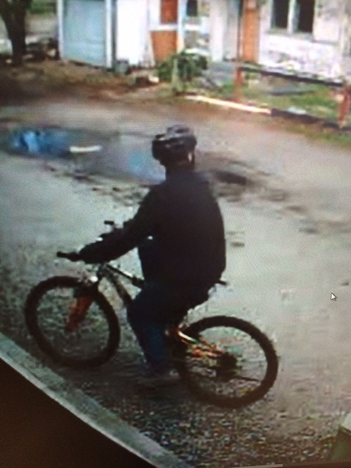 The Spokane Fire Department is looking for the identity of this person seen in the area of three arson fires on Fifth Avenue on March 29, 2015.  (Spokane Fire Department)