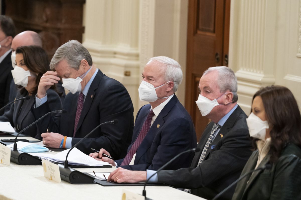 Gov. Kathy Hochul, D-N.Y., left, Gov. Roy Cooper, R-N.C., Gov. Asa Hutchinson, R-Ark., Gov. Phil Murphy, D-N.J., Gov. Gretchen Whitmer , D-Mich., listen as President Joe Biden speaks during a meeting with the National Governors Association in the East Room of the White House, Monday, Jan. 31, 2022, in Washington.  (Alex Brandon)