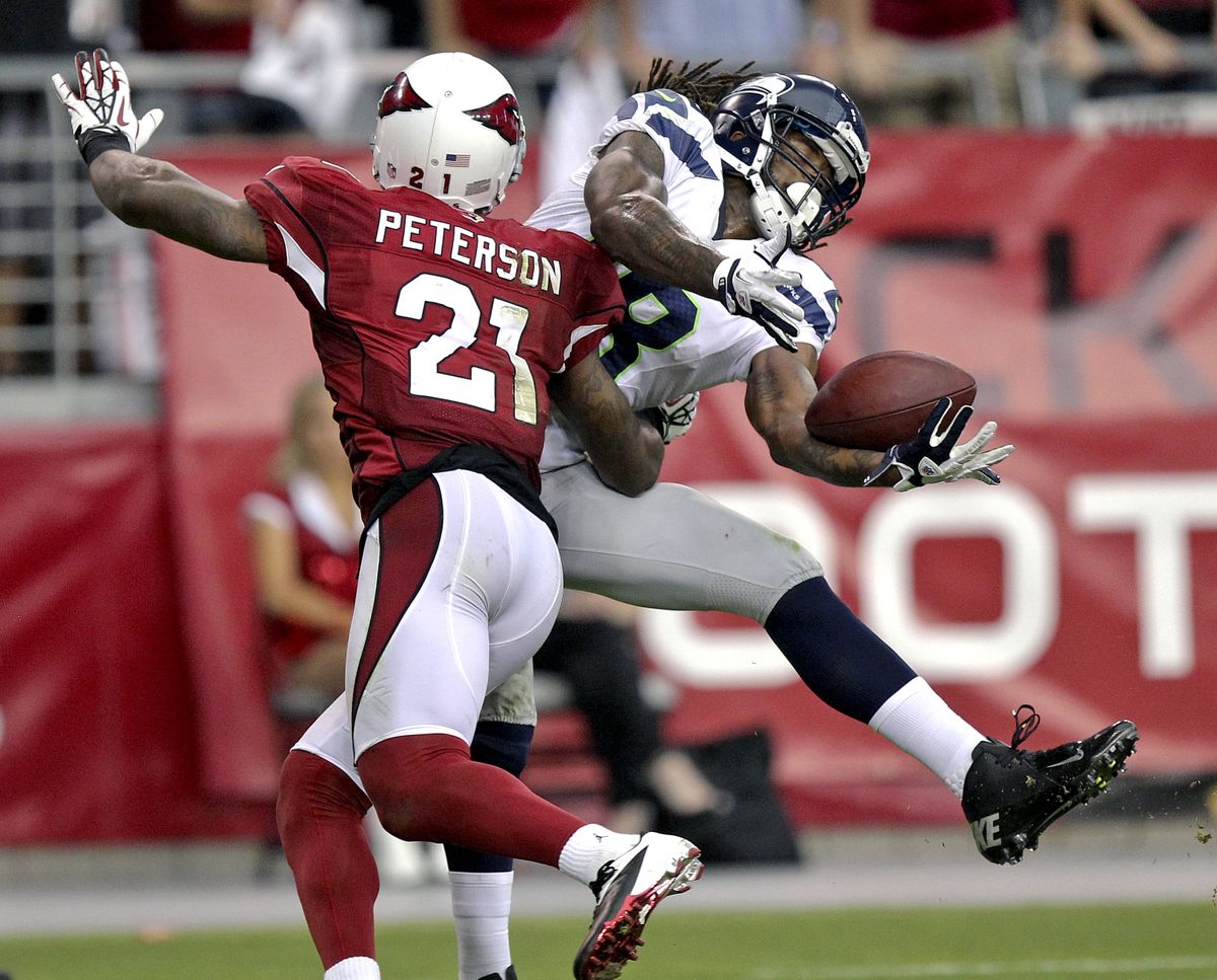 Cardinals cornerback Patrick Peterson interferes with a pass intended for Seahawks receiver Sidney Rice on Seattle’s final drive. (Associated Press)