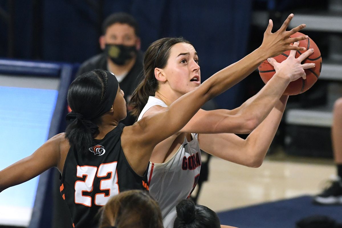 Gonzaga forward Jenn Wirth (3) heads to the basket as Pacific forward Brooklyn McDavid (1) defends during the first half of an NCAA college basketball game, Mon., Jan. 4, 2021, in the McCarthey Athletic Center.  (Colin Mulvany/THE SPOKESMAN-REVIEW)