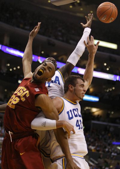 USC’s Taj Gibson battles with UCLA’s Jrue Holiday, center, and Nikola Dragovic.  (Associated Press / The Spokesman-Review)