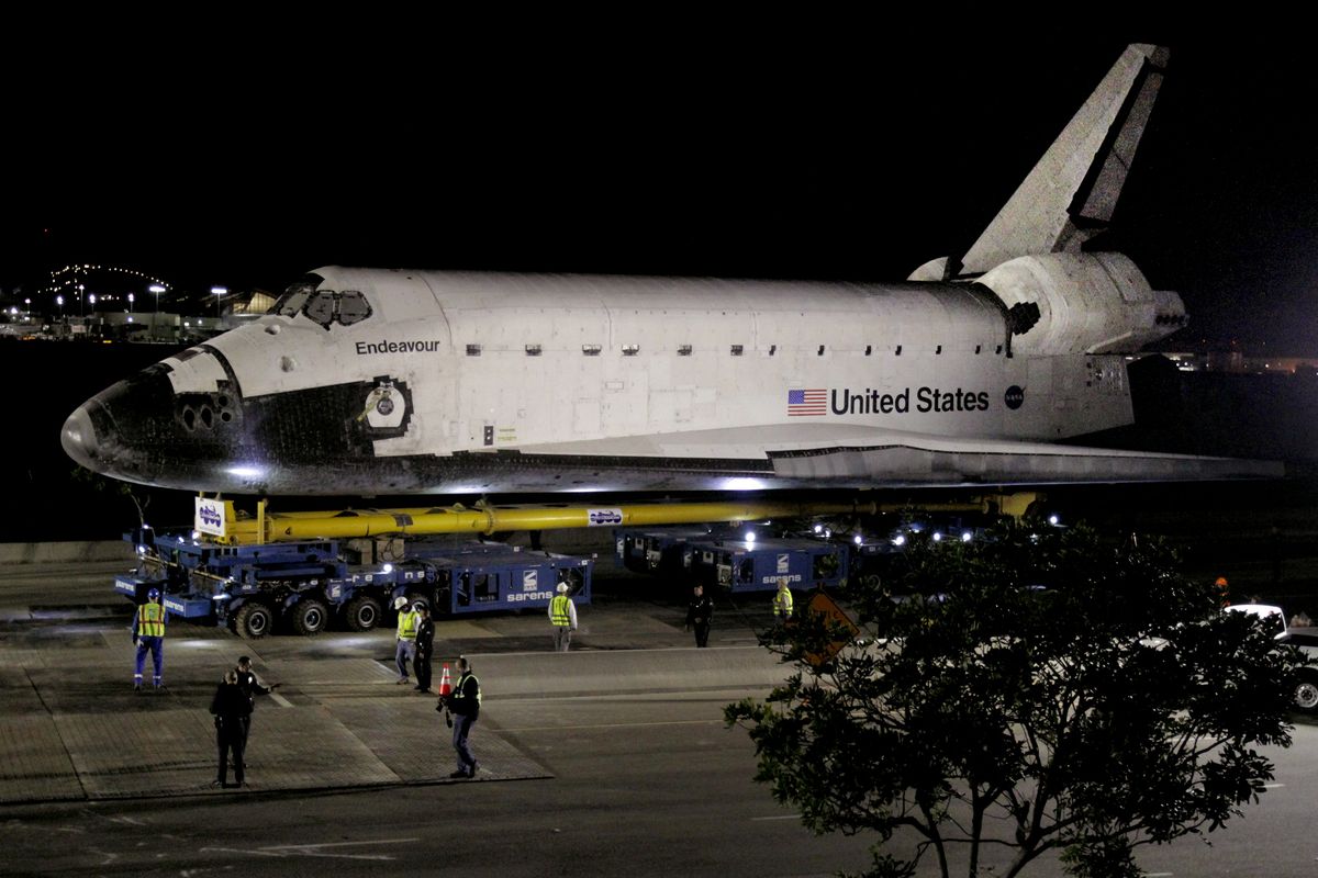 The space shuttle Endeavour leaves Los Angeles International Airport hangar onto the streets in Los Angeles on Friday, Oct. 12, 2012. Endeavour