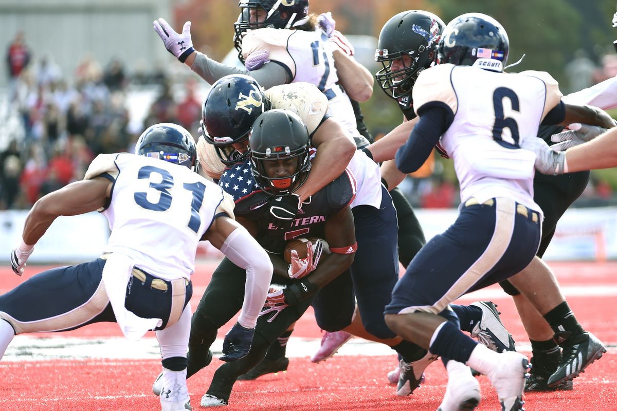 EWU’s Mario Brown is contained and brought down by a sleuth of Bears. Northern Colorado held the Eagles to 417 yards of offense, well below their average of 574. (Tyler Tjomsland)