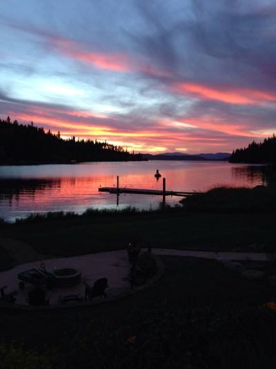 Pastel hues at dusk: Sun retreats to a mountain horizon on Lake Coeur d’Alene.