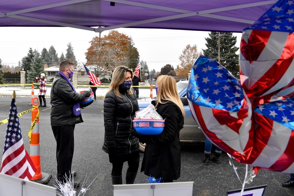 Spokane Mayor Nadine Woodward chats with Gina Grabicki a counselor with Grand Canyon University during a drive through Veterans Day celebration on Wednesday, November 11, 2020, at the Spokane VA in Spokane, Wash. (Tyler Tjomsland/THE SPOKESMAN-REVIEW)